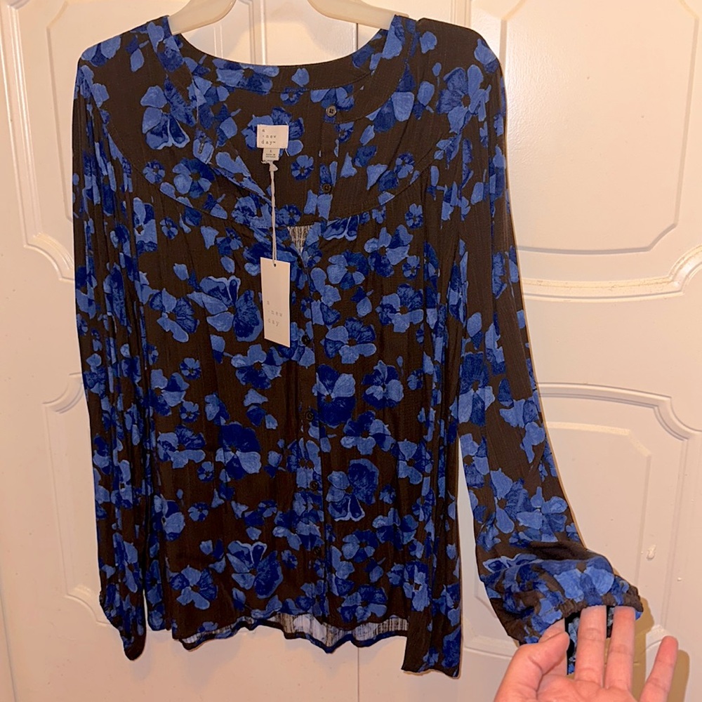 Brown with royal blue buttoned up shirt. (L)